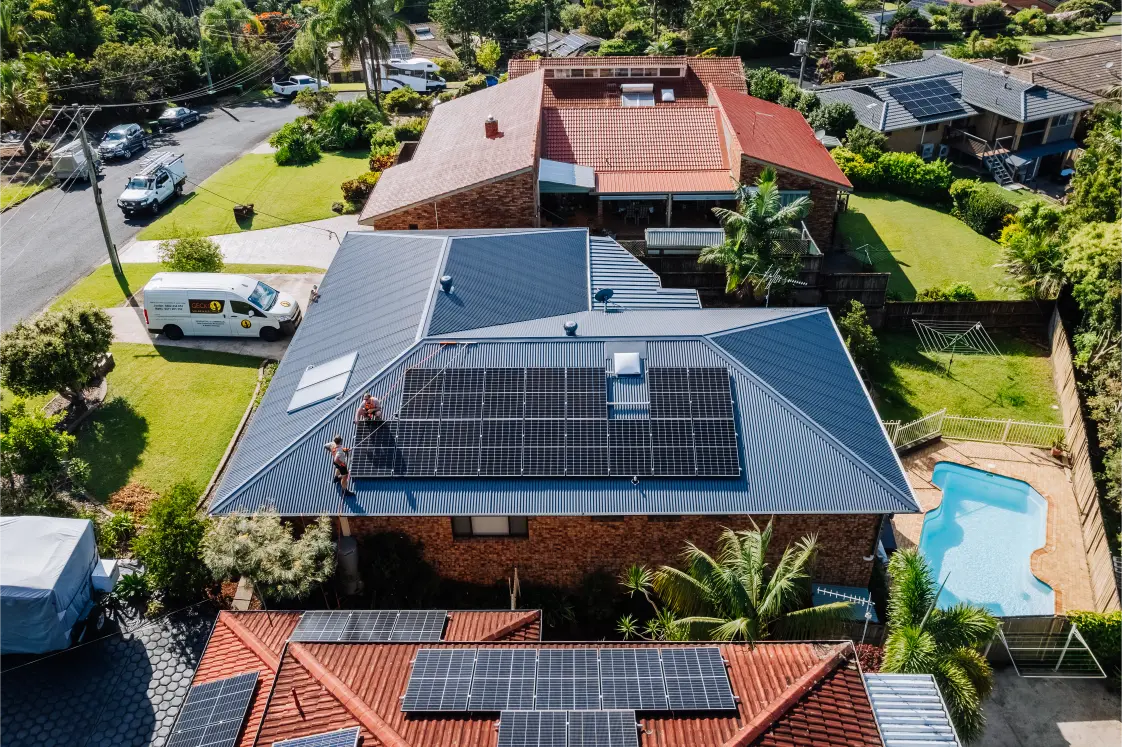Residential solar install with a Gecko van in the driveway